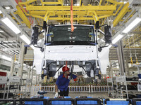 A worker works on an automobile production line at BYD Industrial Co LTD in Huai'an, China, on August 26, 2024. (