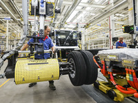 A worker works on an automobile production line at BYD Industrial Co LTD in Huai'an, China, on August 26, 2024. (