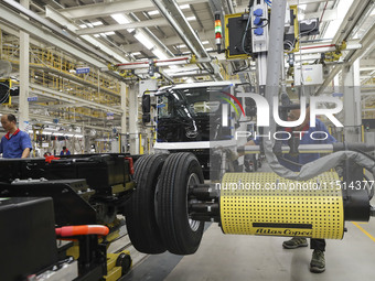 A worker works on an automobile production line at BYD Industrial Co LTD in Huai'an, China, on August 26, 2024. (