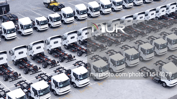 New energy commercial vehicles are produced by BYD Industrial Co., Ltd. in Huai'an, China, on August 26, 2024. 