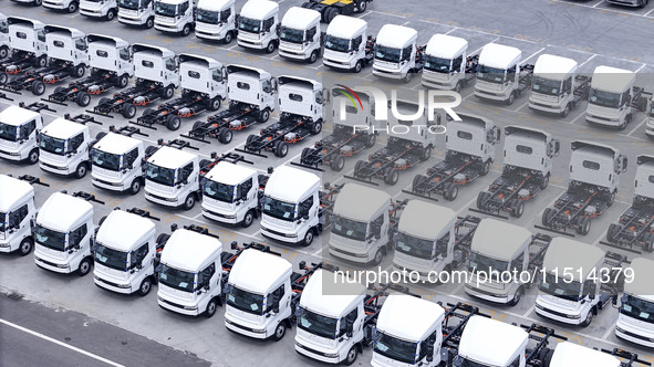 New energy commercial vehicles are produced by BYD Industrial Co., Ltd. in Huai'an, China, on August 26, 2024. 