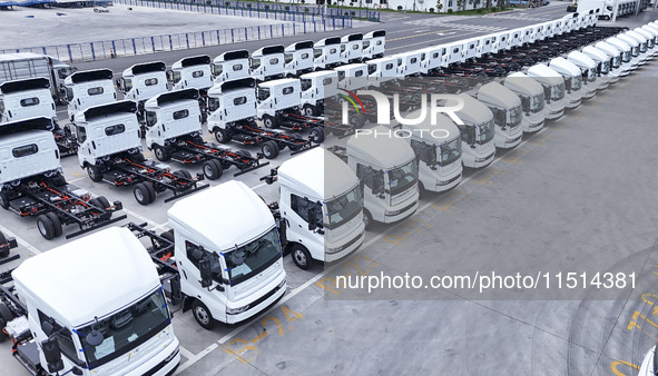 New energy commercial vehicles are produced by BYD Industrial Co., Ltd. in Huai'an, China, on August 26, 2024. 