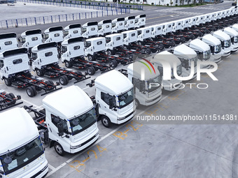 New energy commercial vehicles are produced by BYD Industrial Co., Ltd. in Huai'an, China, on August 26, 2024. (