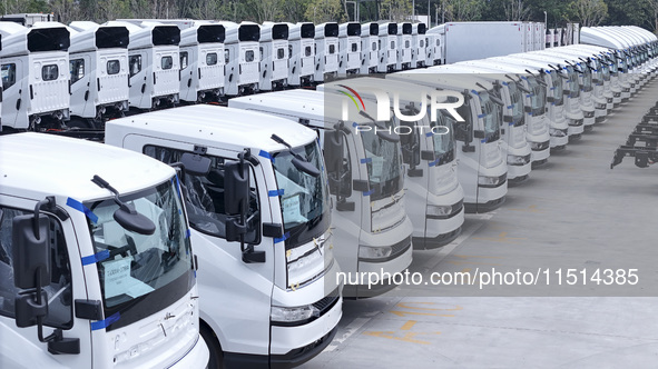 New energy commercial vehicles are produced by BYD Industrial Co., Ltd. in Huai'an, China, on August 26, 2024. 