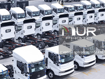 New energy commercial vehicles are produced by BYD Industrial Co., Ltd. in Huai'an, China, on August 26, 2024. (