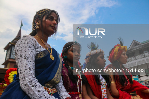 Hindu devotees celebrate the Janmashtami festival that marks the birthday of the Hindu god Krishna with a procession in Srinagar, Jammu and...