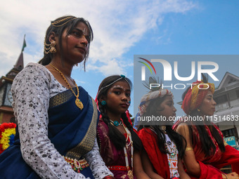 Hindu devotees celebrate the Janmashtami festival that marks the birthday of the Hindu god Krishna with a procession in Srinagar, Jammu and...