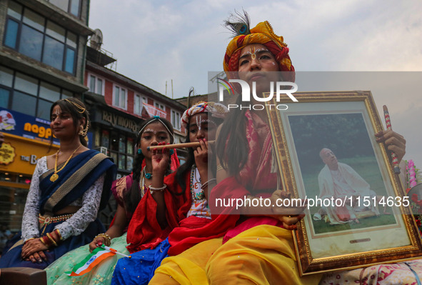 Hindu devotees celebrate the Janmashtami festival that marks the birthday of the Hindu god Krishna with a procession in Srinagar, Jammu and...