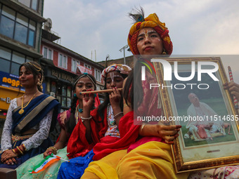 Hindu devotees celebrate the Janmashtami festival that marks the birthday of the Hindu god Krishna with a procession in Srinagar, Jammu and...