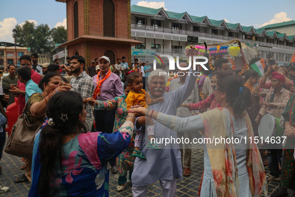 Hindu devotees dance as they celebrate the Janmashtami festival that marks the birthday of the Hindu god Krishna with a procession in Srinag...