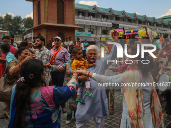 Hindu devotees dance as they celebrate the Janmashtami festival that marks the birthday of the Hindu god Krishna with a procession in Srinag...