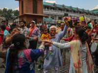 Hindu devotees dance as they celebrate the Janmashtami festival that marks the birthday of the Hindu god Krishna with a procession in Srinag...