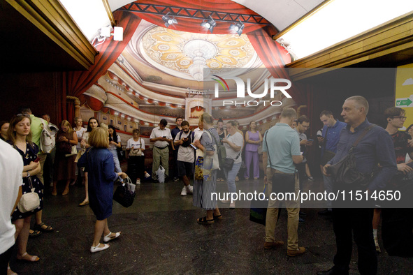 People wait out an air raid alarm at the Teatralna metro station during the massive Russian drone and missile attack on Ukraine in Kyiv, Ukr...