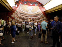 People wait out an air raid alarm at the Teatralna metro station during the massive Russian drone and missile attack on Ukraine in Kyiv, Ukr...