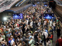 People crowd on the platform during an air raid alarm at the Osokorky metro station during the massive Russian drone and missile attack in K...