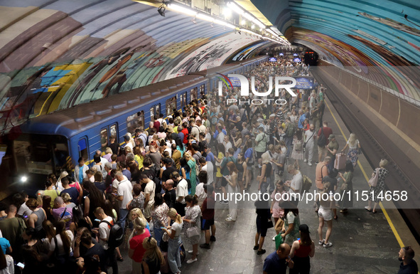 People shelter at the Osokorky metro station during the massive Russian drone and missile attack in Kyiv, Ukraine, on August 26, 2024. NO US...