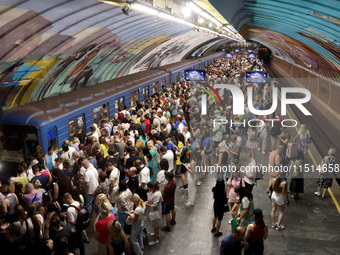 People shelter at the Osokorky metro station during the massive Russian drone and missile attack in Kyiv, Ukraine, on August 26, 2024. NO US...