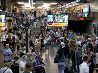 People wait out an air raid alarm at the Pozniaky metro station during the massive Russian drone and missile attack on Ukraine in Kyiv, Ukra...