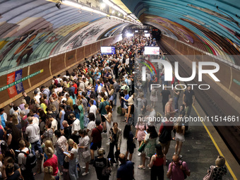 People shelter at the Osokorky metro station during the massive Russian drone and missile attack in Kyiv, Ukraine, on August 26, 2024. NO US...