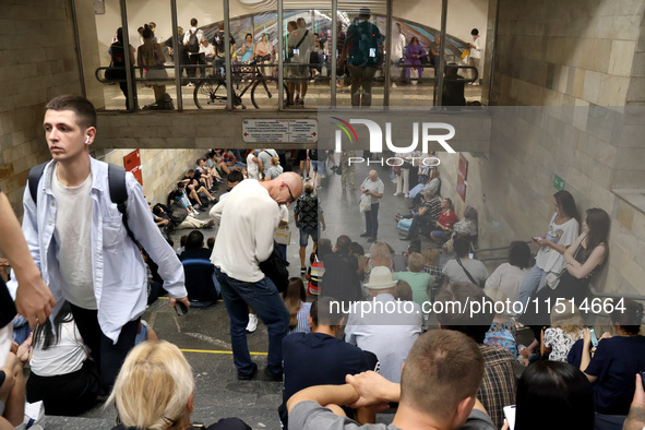 People shelter at the Osokorky metro station during the massive Russian drone and missile attack in Kyiv, Ukraine, on August 26, 2024. NO US...