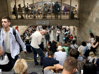 People shelter at the Osokorky metro station during the massive Russian drone and missile attack in Kyiv, Ukraine, on August 26, 2024. NO US...