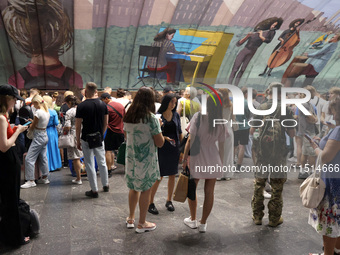 People shelter at the Osokorky metro station during the massive Russian drone and missile attack in Kyiv, Ukraine, on August 26, 2024. NO US...