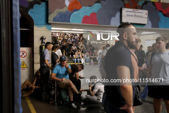 People shelter at the Osokorky metro station during the massive Russian drone and missile attack in Kyiv, Ukraine, on August 26, 2024. NO US...