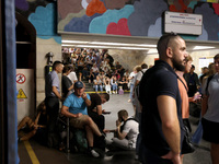 People shelter at the Osokorky metro station during the massive Russian drone and missile attack in Kyiv, Ukraine, on August 26, 2024. NO US...