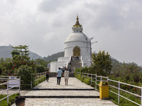 Shanti Stupa in Pokhara known as World Peace Pagoda with religious pilgrims and visitors, is a Buddhist monument situated at the height of 1...