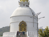 Shanti Stupa in Pokhara known as World Peace Pagoda with religious pilgrims and visitors, is a Buddhist monument situated at the height of 1...