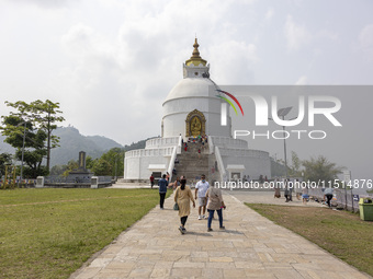 Shanti Stupa in Pokhara known as World Peace Pagoda with religious pilgrims and visitors, is a Buddhist monument situated at the height of 1...