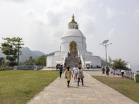 Shanti Stupa in Pokhara known as World Peace Pagoda with religious pilgrims and visitors, is a Buddhist monument situated at the height of 1...