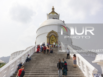 Shanti Stupa in Pokhara known as World Peace Pagoda with religious pilgrims and visitors, is a Buddhist monument situated at the height of 1...