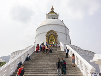 Shanti Stupa in Pokhara known as World Peace Pagoda with religious pilgrims and visitors, is a Buddhist monument situated at the height of 1...