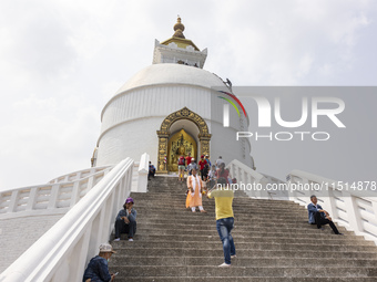 Shanti Stupa in Pokhara known as World Peace Pagoda with religious pilgrims and visitors, is a Buddhist monument situated at the height of 1...