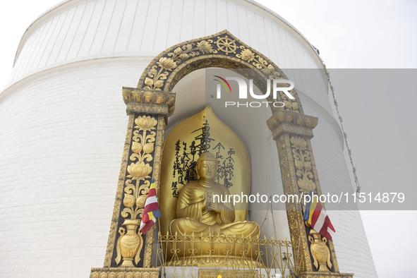 Shanti Stupa in Pokhara known as World Peace Pagoda with religious pilgrims and visitors, is a Buddhist monument situated at the height of 1...