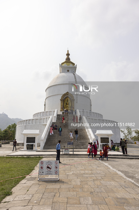 Shanti Stupa in Pokhara known as World Peace Pagoda with religious pilgrims and visitors, is a Buddhist monument situated at the height of 1...