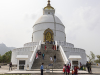 Shanti Stupa in Pokhara known as World Peace Pagoda with religious pilgrims and visitors, is a Buddhist monument situated at the height of 1...