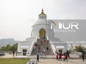 Shanti Stupa in Pokhara known as World Peace Pagoda with religious pilgrims and visitors, is a Buddhist monument situated at the height of 1...