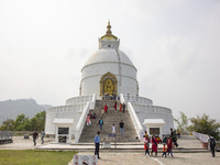 Shanti Stupa in Pokhara known as World Peace Pagoda with religious pilgrims and visitors, is a Buddhist monument situated at the height of 1...