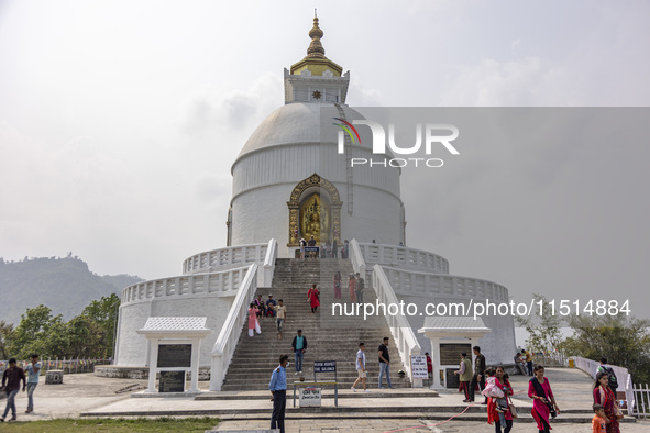 Shanti Stupa in Pokhara known as World Peace Pagoda with religious pilgrims and visitors, is a Buddhist monument situated at the height of 1...