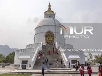 Shanti Stupa in Pokhara known as World Peace Pagoda with religious pilgrims and visitors, is a Buddhist monument situated at the height of 1...