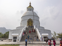 Shanti Stupa in Pokhara known as World Peace Pagoda with religious pilgrims and visitors, is a Buddhist monument situated at the height of 1...