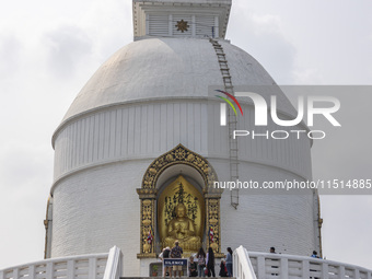 Shanti Stupa in Pokhara known as World Peace Pagoda with religious pilgrims and visitors, is a Buddhist monument situated at the height of 1...