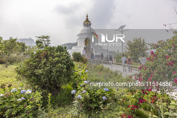 Shanti Stupa in Pokhara known as World Peace Pagoda with religious pilgrims and visitors, is a Buddhist monument situated at the height of 1...