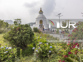 Shanti Stupa in Pokhara known as World Peace Pagoda with religious pilgrims and visitors, is a Buddhist monument situated at the height of 1...