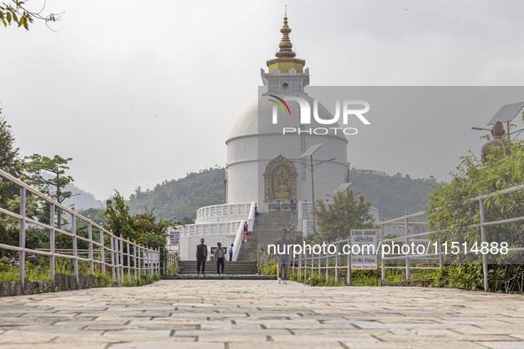 Shanti Stupa in Pokhara known as World Peace Pagoda with religious pilgrims and visitors, is a Buddhist monument situated at the height of 1...