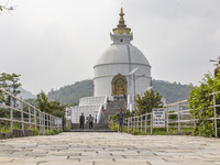 Shanti Stupa in Pokhara known as World Peace Pagoda with religious pilgrims and visitors, is a Buddhist monument situated at the height of 1...