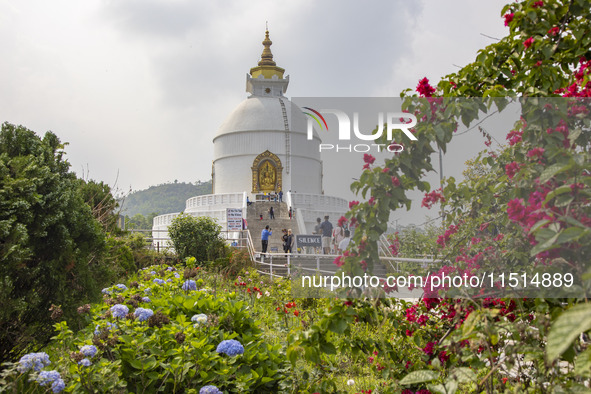 Shanti Stupa in Pokhara known as World Peace Pagoda with religious pilgrims and visitors, is a Buddhist monument situated at the height of 1...