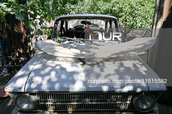 A damaged car is at the house of a victim of the Russian missile attack in Zaporizhzhia region, Ukraine, on August 26, 2024. NO USE RUSSIA....